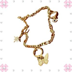 Bracelet - 9” - gold tone with clip on charms - star, eye, butterfly. New!